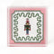 Nutcracker Square Acrylic Tray with in medium size with pink and green border and Nutcracker in the center.