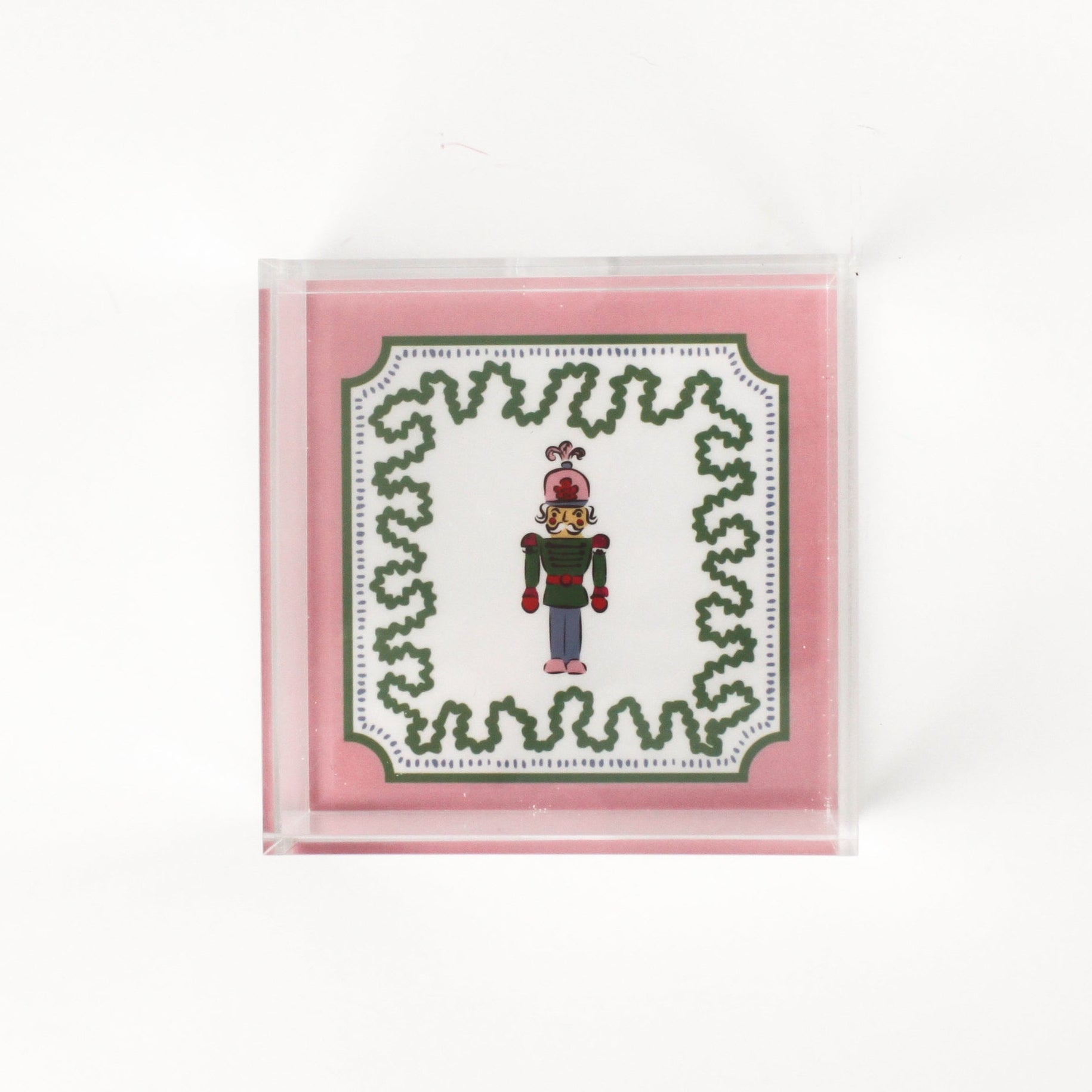 Nutcracker Square Acrylic Tray with in small size with pink and green border and Nutcracker in the center.