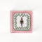 Nutcracker Square Acrylic Tray with in small size with pink and green border and Nutcracker in the center.