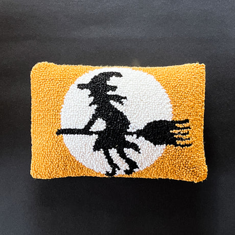 Madcap Cottage black witch on an orange wool Halloween throw pillow