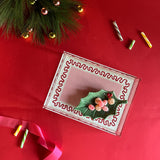 Harbor Trail red and pink with green dash Rectangular Acrylic Tray.  Large pink rectangle in the center with green dashes and red squiggle. A Christmas tree branch and candy are partially in the image.