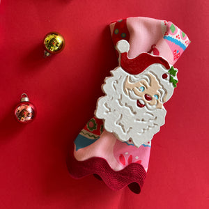 madcap cottage hand-painted metal napkin rings featuring a Jolly Santa design.
