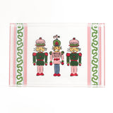 Three Nutcrackers on white background bordered with pink, blue, and green acrylic trays in small size.