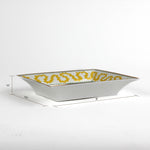 dimensions of the Madcap Cottage yellow and white porcelain trinket tray with a gold border and a saying that says Tell Stories. 1.5" x 6.5" x 8"