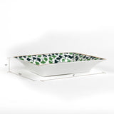dimensions of A rectangular porcelain trinket tray with a blue-and-green gingko-leaf patterned trim and gilt edging. The tray has text inside that reads 'You only live once, so don't settle for boring and expected.  1.5" x 6.5" x 8"