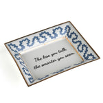 Madcap Cottage blue and white trinket tray with a gold border and a saying that says The less you talk, the smarter you seem. 