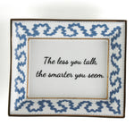 Madcap Cottage blue and white trinket tray with a gold border and a saying that says The less you talk, the smarter you seem. 