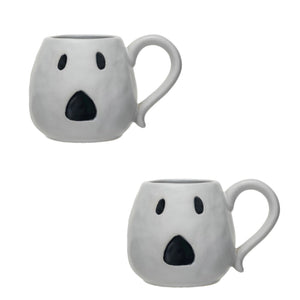White ceramic mugs with a jack o'lantern design, one with a handle
