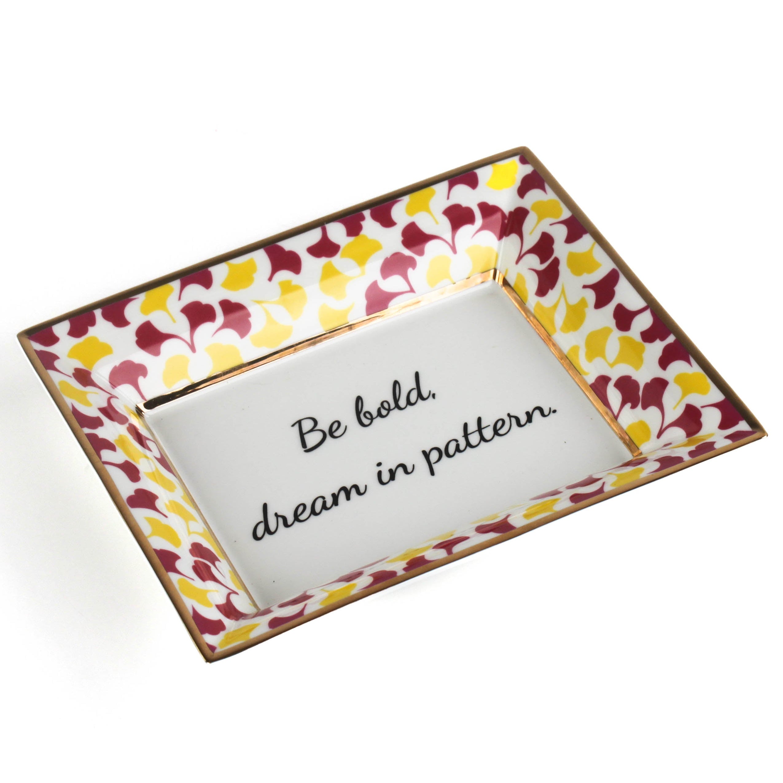 Madcap cottage rhubarb pink and yellow trinket tray with the saying be bold, dream in pattern.