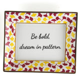 Madcap cottage rhubarb pink and yellow trinket tray with the saying be bold, dream in pattern.