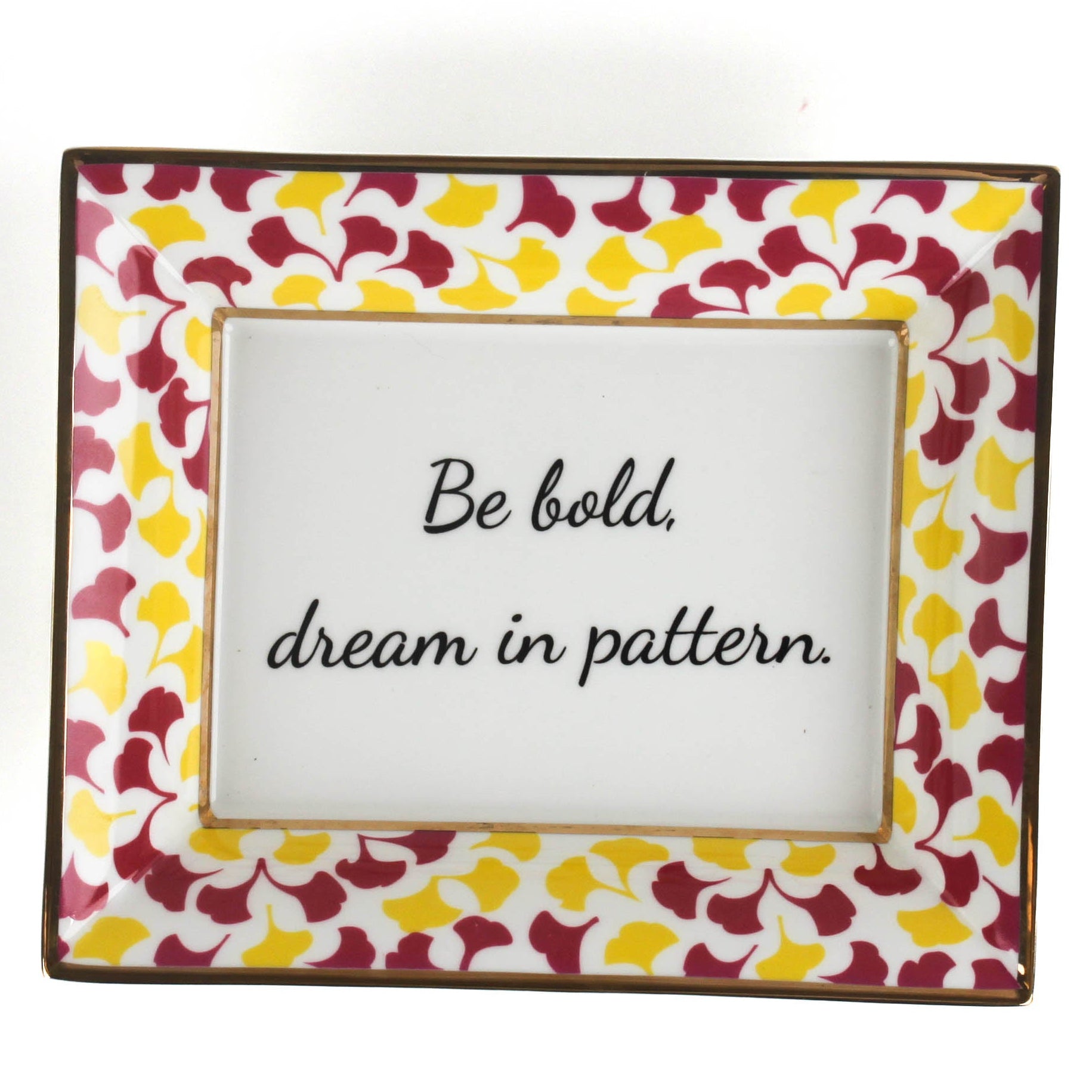 Madcap cottage rhubarb pink and yellow trinket tray with the saying be bold, dream in pattern.