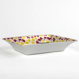 side view of Madcap cottage rhubarb pink and yellow trinket tray with the saying be bold, dream in pattern.