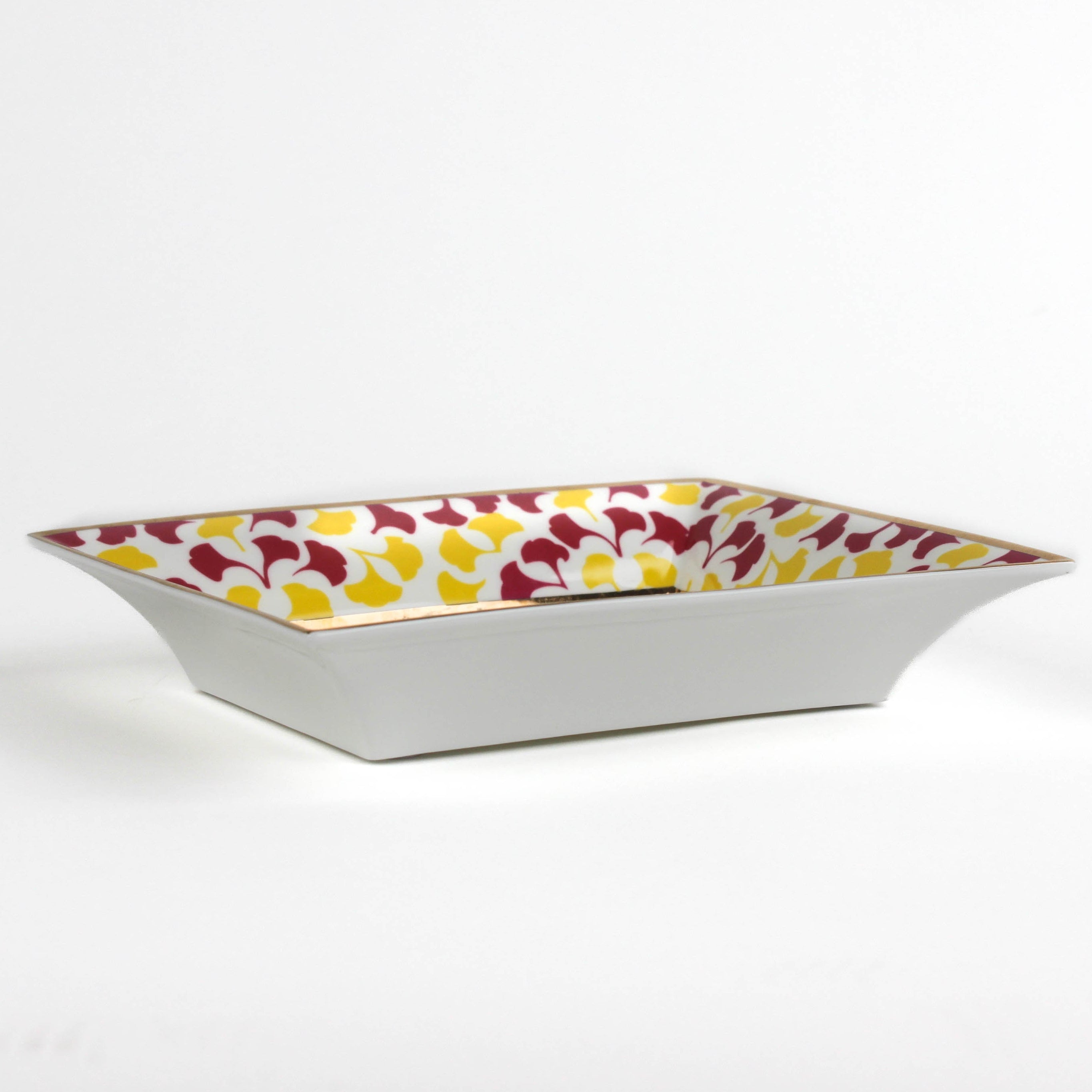 side view of Madcap cottage rhubarb pink and yellow trinket tray with the saying be bold, dream in pattern.