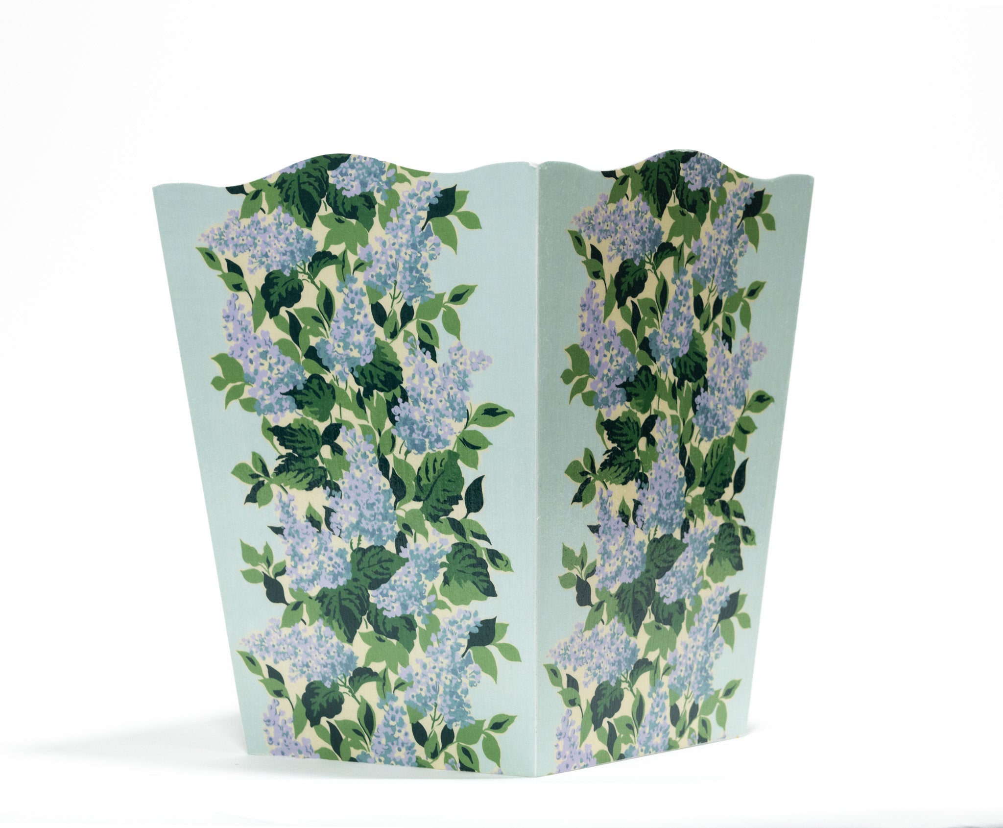 a blue floral wastepaper basket with a central repeating hydrangea pattern on each side. 