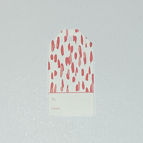 A pink gift tag with a geometric pattern, displayed on a white background