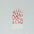 A red gift tag with a geometric pattern, displayed on a white background