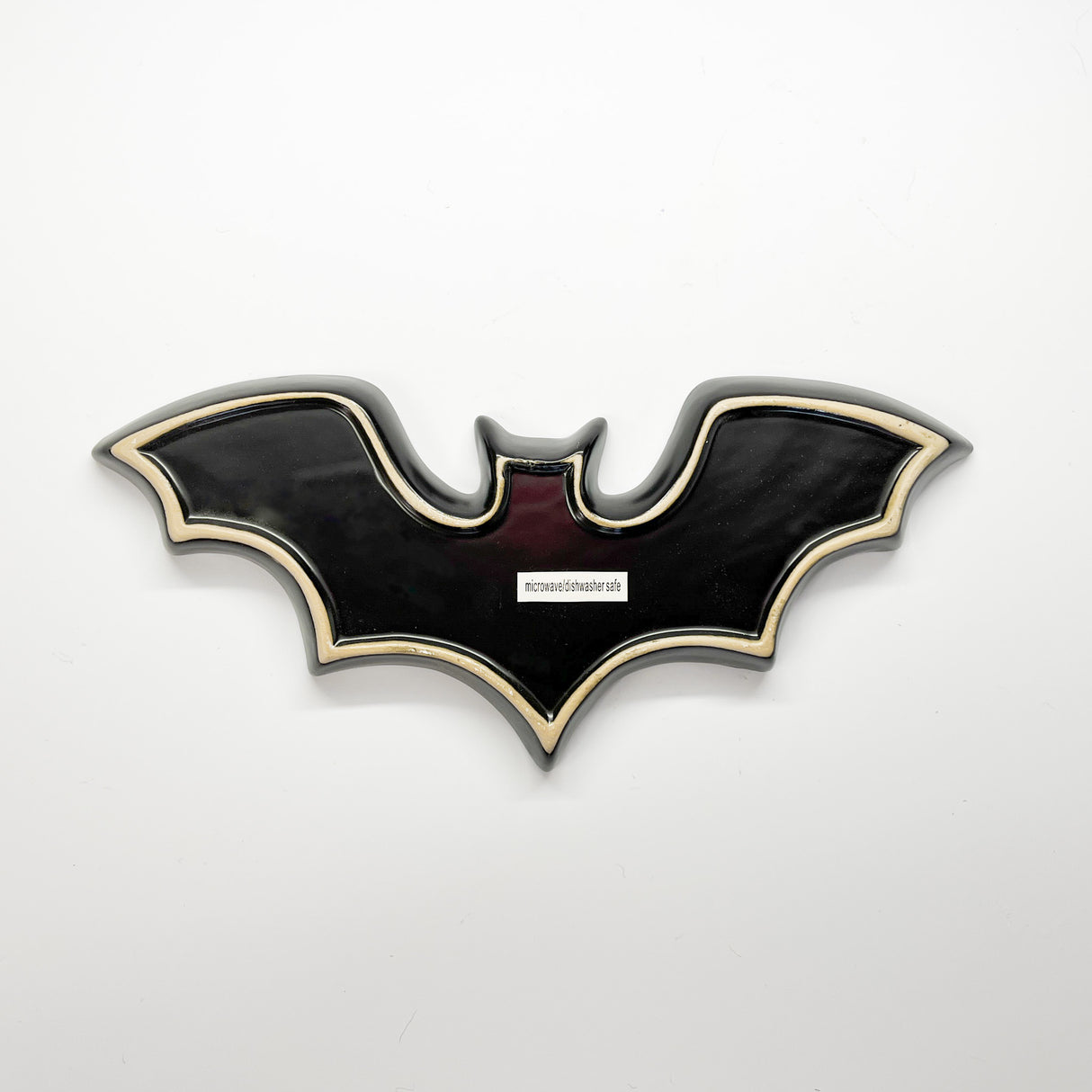 Madcap cottage black bat shaped halloween plate back view with white outline