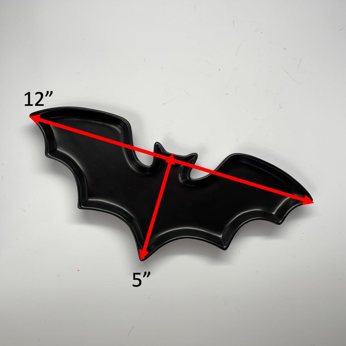 Madcap cottage black bat shaped ceramic halloween plate dimension are 12" by 5"