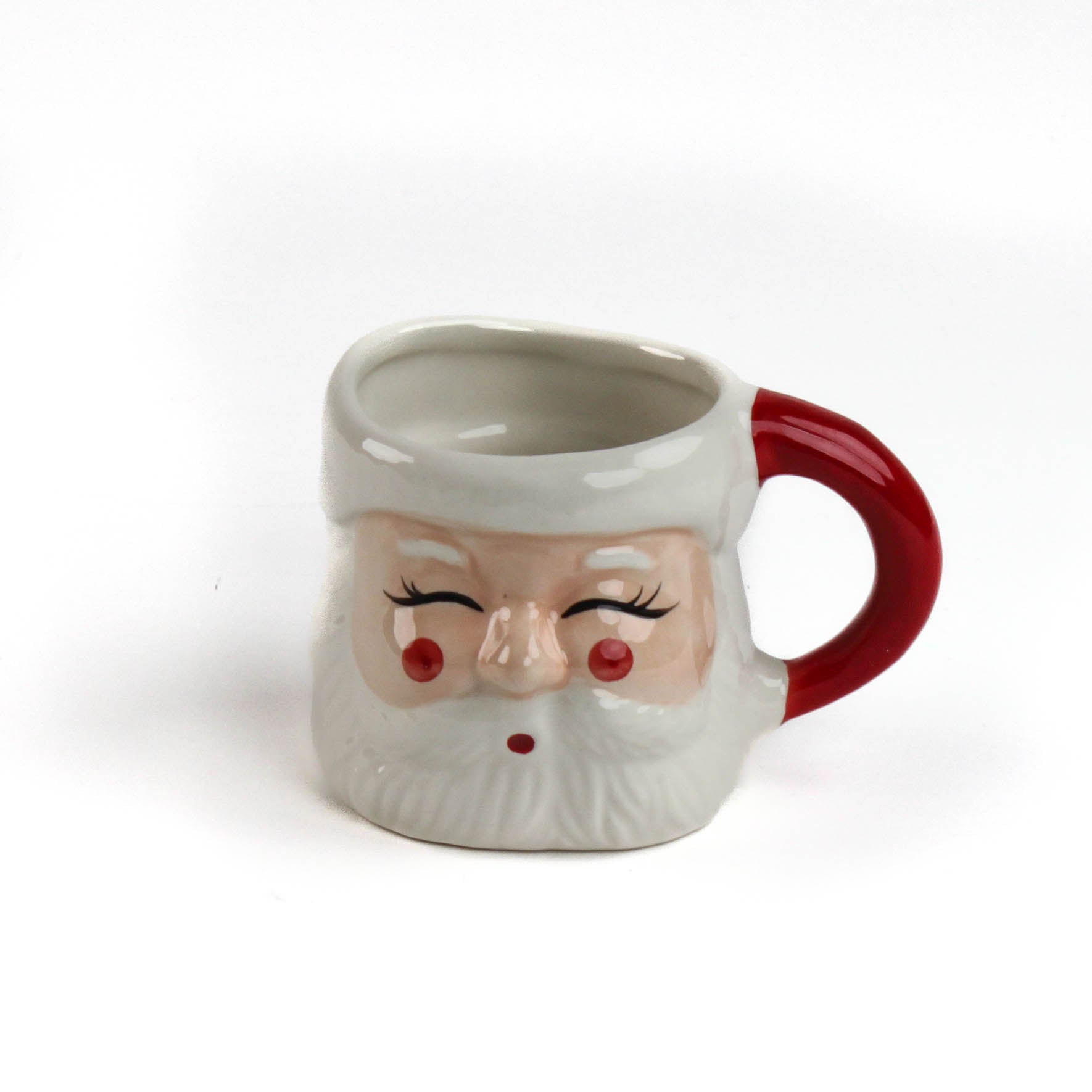 Ceramic Christmas santa mug with a jolly santa face design with red cheeks and a red handle on a white background