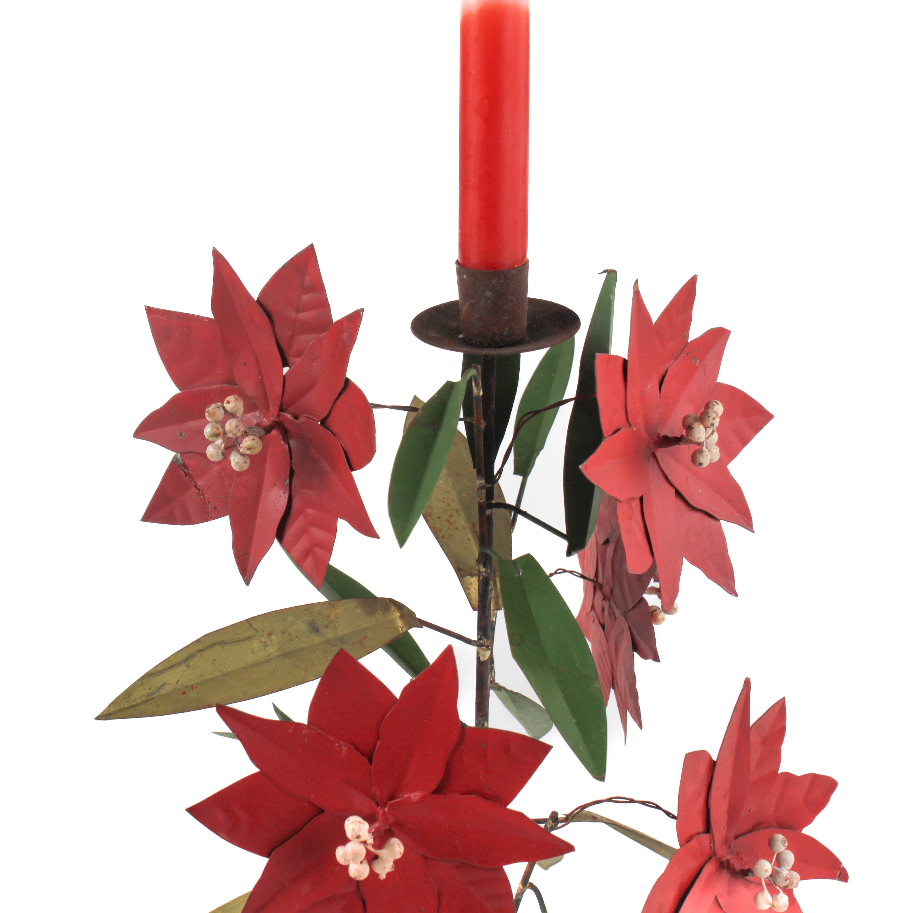 detailed image of a large tole metal christmas candle holder in the shape of a poinsettia plant.