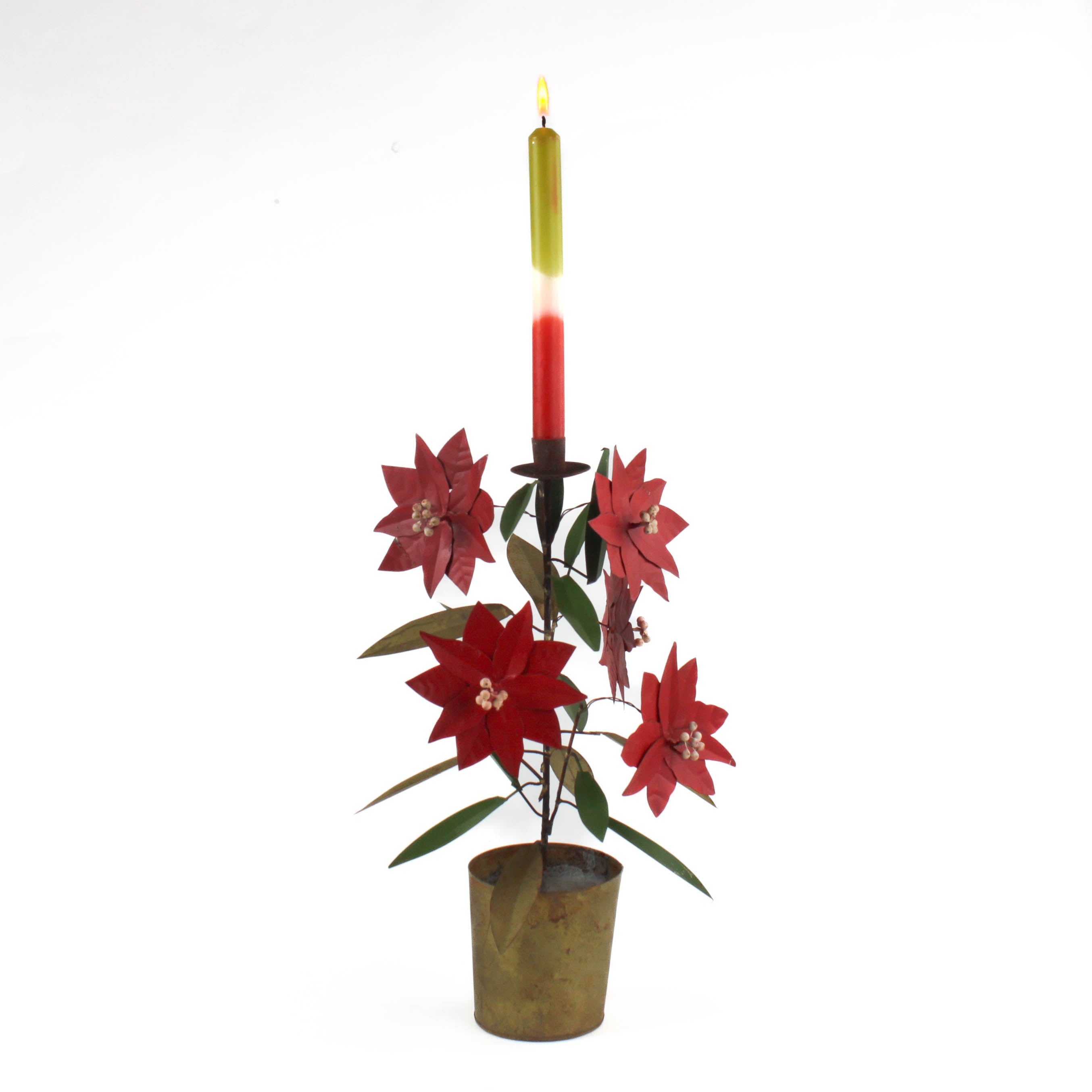 A large tole metal christmas candle holder in the shape of a poinsettia plant.