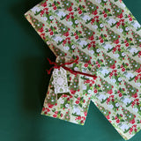 Pug Christmas Wrapping paper with a pug and Christmas tree motif