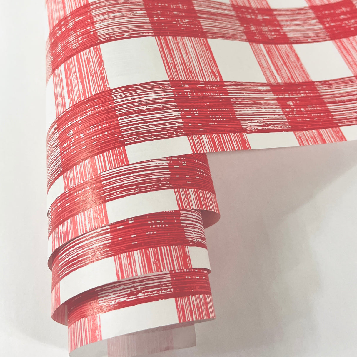 A red gingham paper table runner from madcap cottage's line of disposable table runners