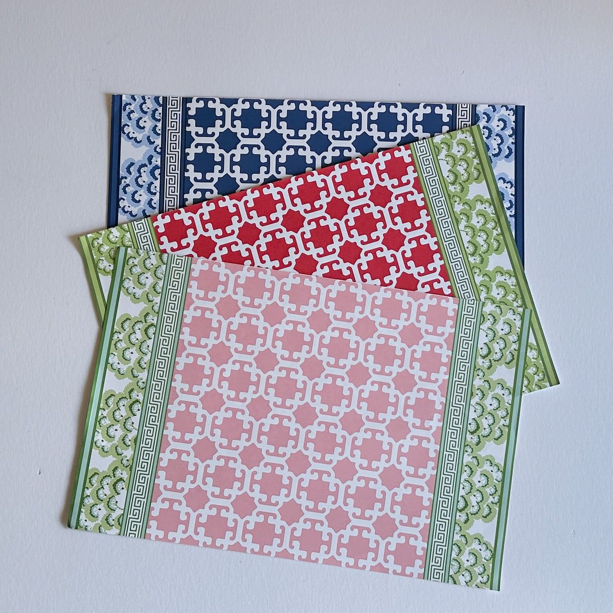 three pads of Designer paper placemats in a trellis pattern called "Monserrat" by Madcap Cottage