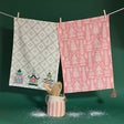 Three Embroidered Pagodas on White and Many White Pagodas on Pink Tea Towels