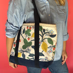 a navy and white tote made from strawberry fabric