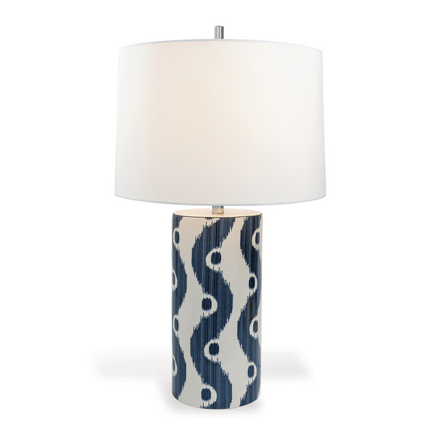 A blue and white table lamp featuring a white porcelain base with blue squiggle motif and a white lampshade.