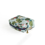 Meadow Club toiletry bag in sky blue features a lily pond pattern in a white background