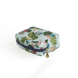 Meadow Club toiletry bag in sky blue features a lily pond pattern in a white background