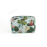 Meadow Club toiletry bag in sky blue features a lily pond pattern in a white background