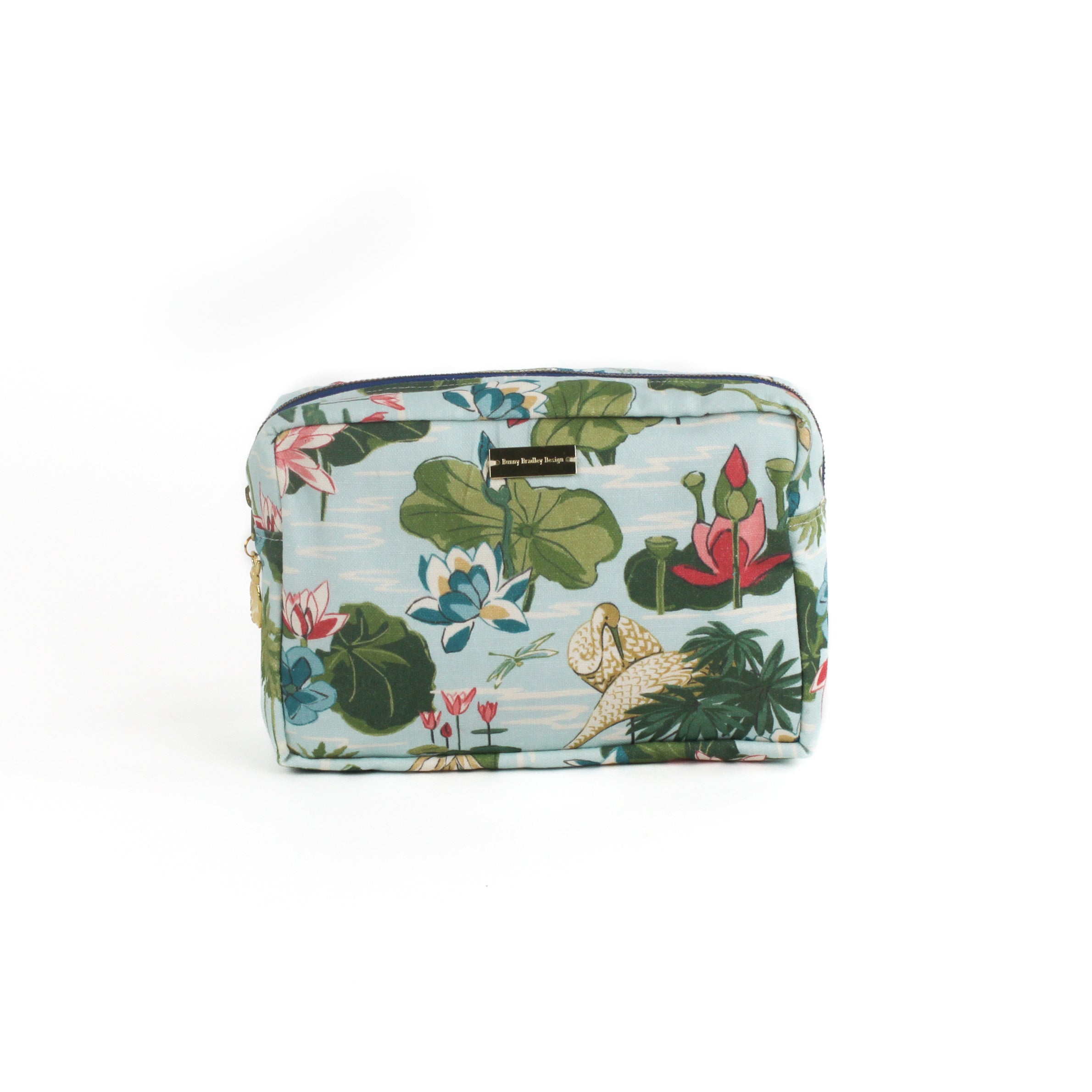 Meadow Club toiletry bag in sky blue features a lily pond pattern in a white background