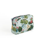Meadow Club toiletry bag in sky blue features a lily pond pattern in a white background