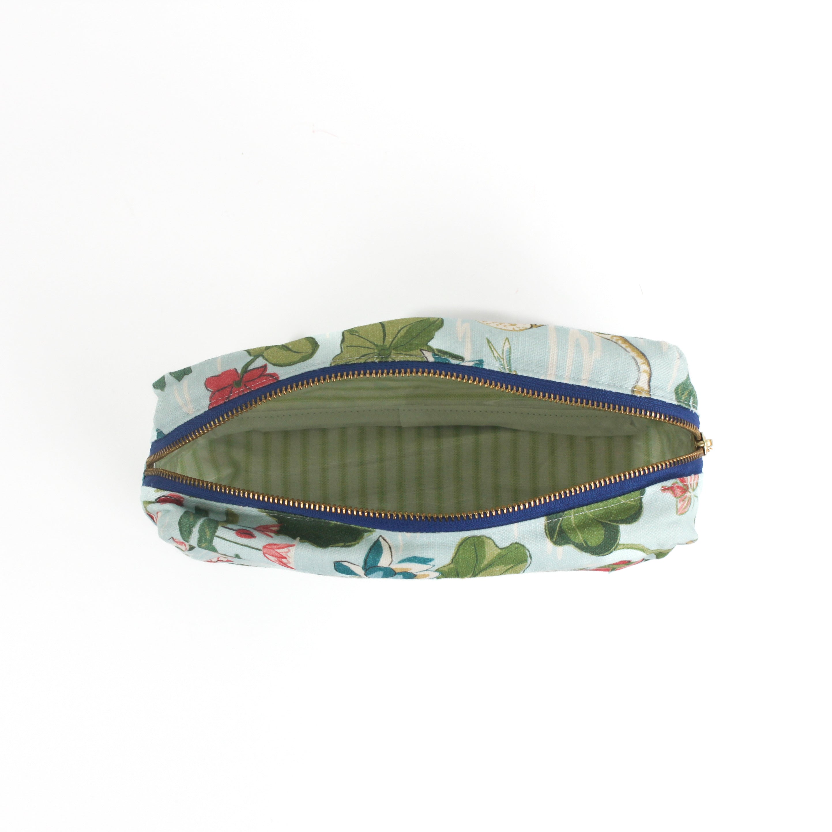 Meadow Club toiletry bag in sky blue features a lily pond pattern in a white background