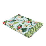 a green and blue floral tea towel with heron and waterlily motifs against a white background. 