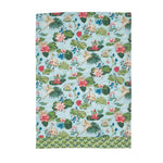 a green and blue floral tea towel with heron and waterlily motifs against a white background. 