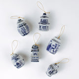 Elegant blue and white porcelain Christmas chinoiserie ginger jar ornaments on a white background. 