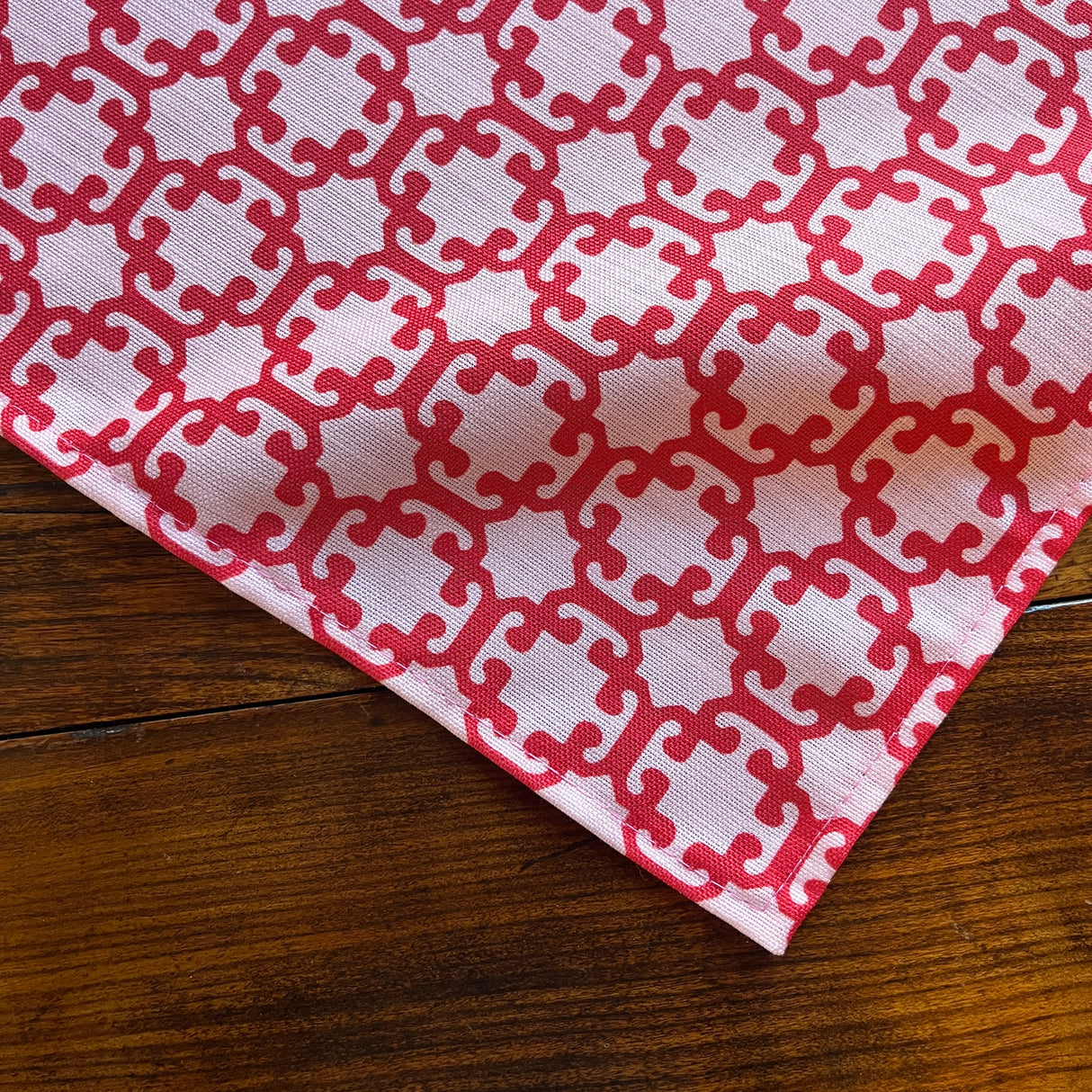 Detailed view of the geometric motif on the Monserrat Lacquer Red cloth tabble runner