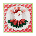 Christmas Pugs Square Paper Placemats in a white surface with a white plate is placed on top of it with a cloth and a santa napkin ring