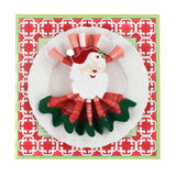 Christmas Pugs Square Paper Placemats in a white surface with a white plate is placed on top of it with a cloth and a santa napkin ring