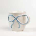 Ceramic Blue Bow Mug in a white background