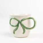 Ceramic green Bow Mug in a white background