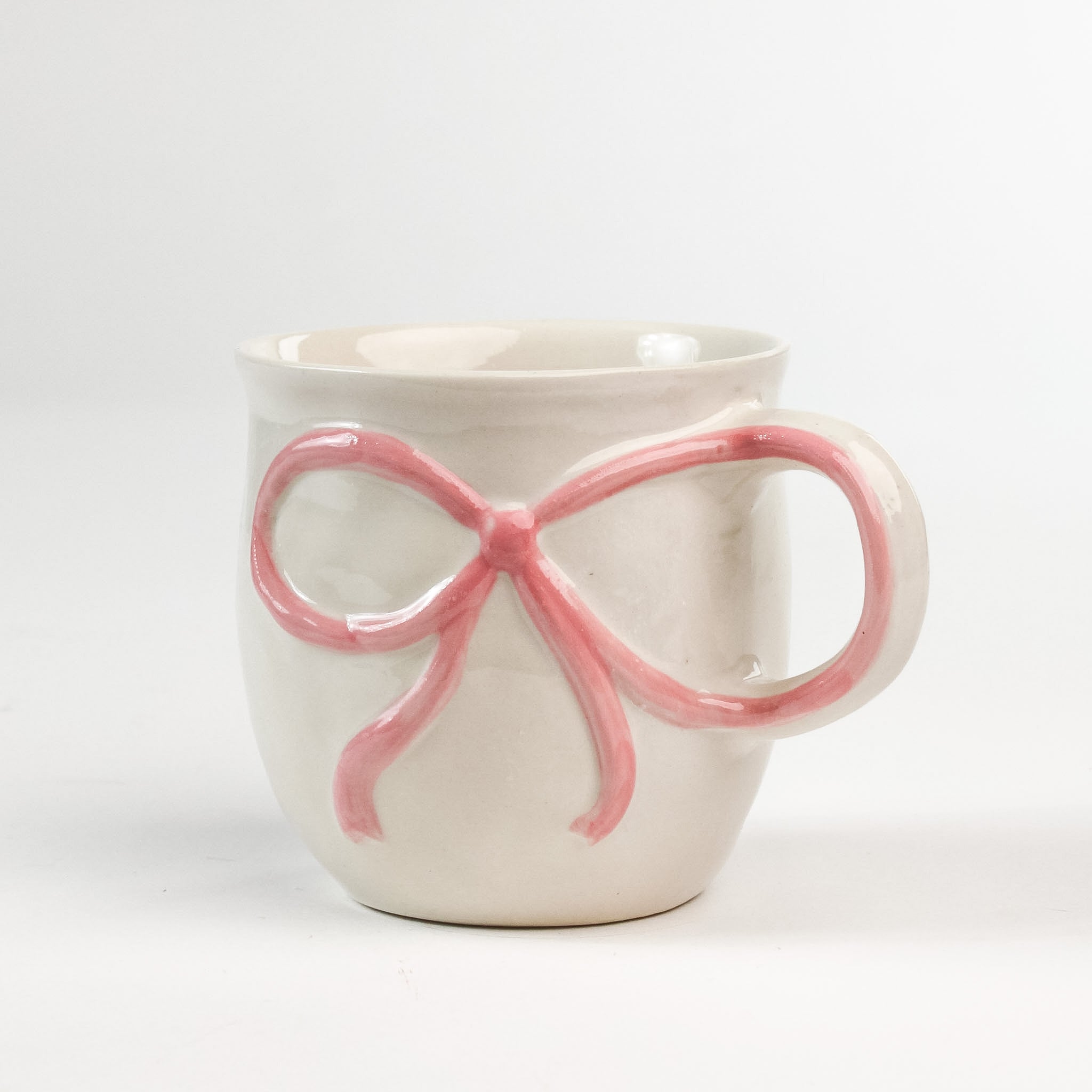 Ceramic pink Bow Mug in a white background