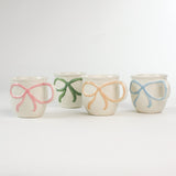 4 Multicolored Ceramic Bow Mugs in a white background