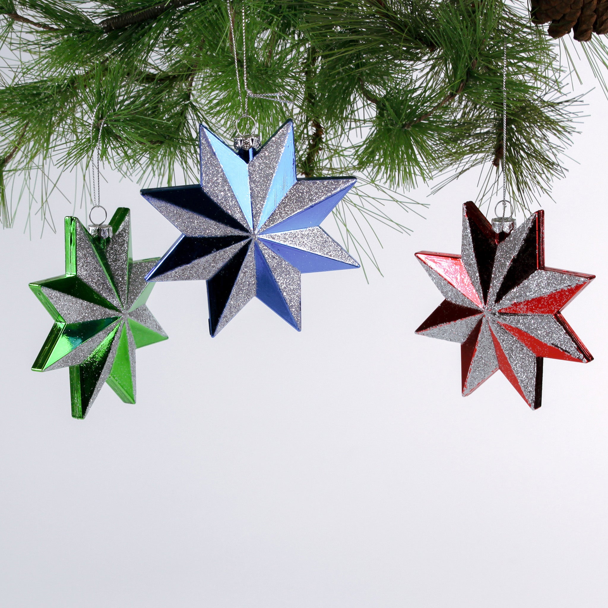 Set of three glittered star Christmas ornaments in assorted metallic colors