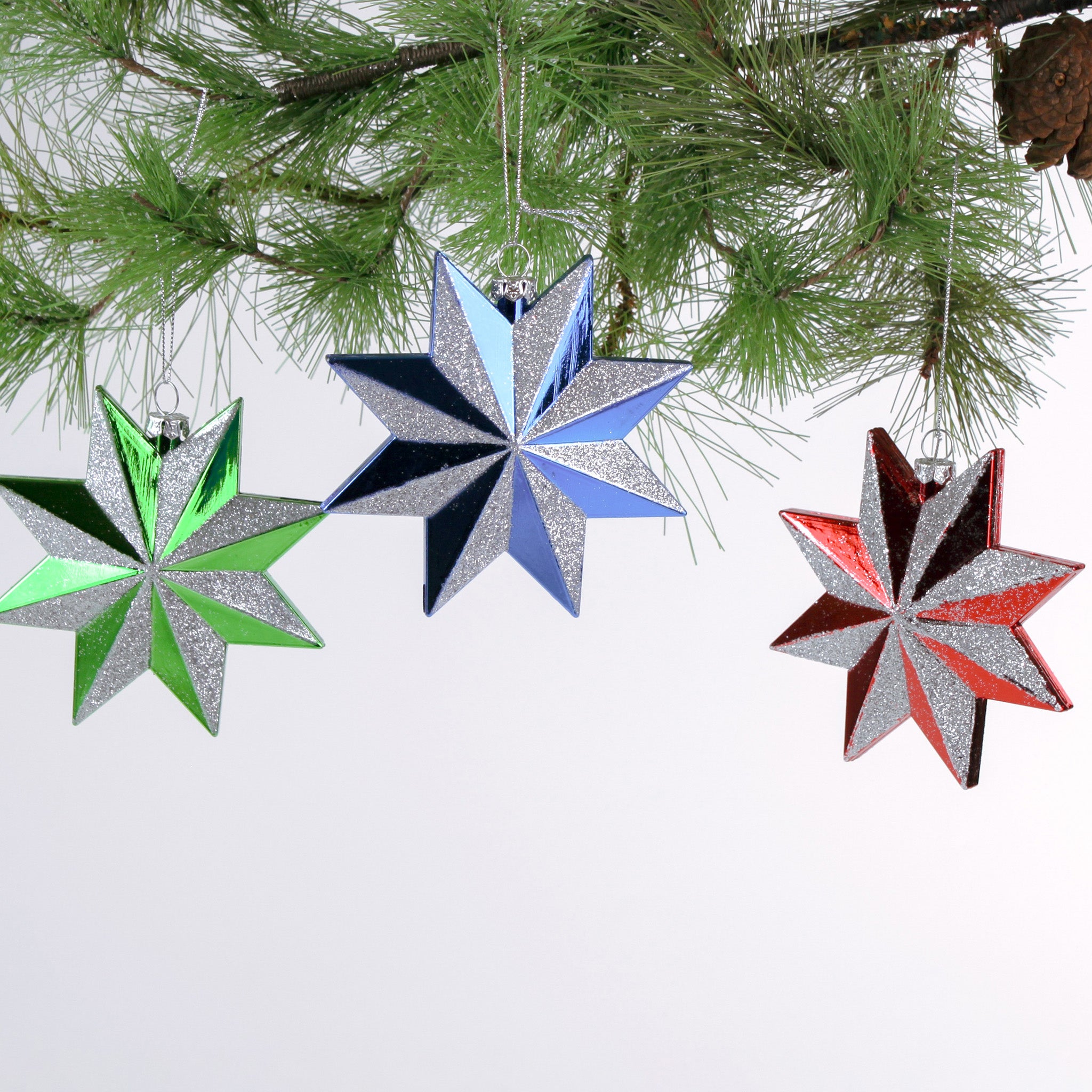 Set of three glittered star Christmas ornaments in assorted metallic colors