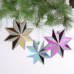 Set of three glittered star Christmas ornaments in assorted metallic colors